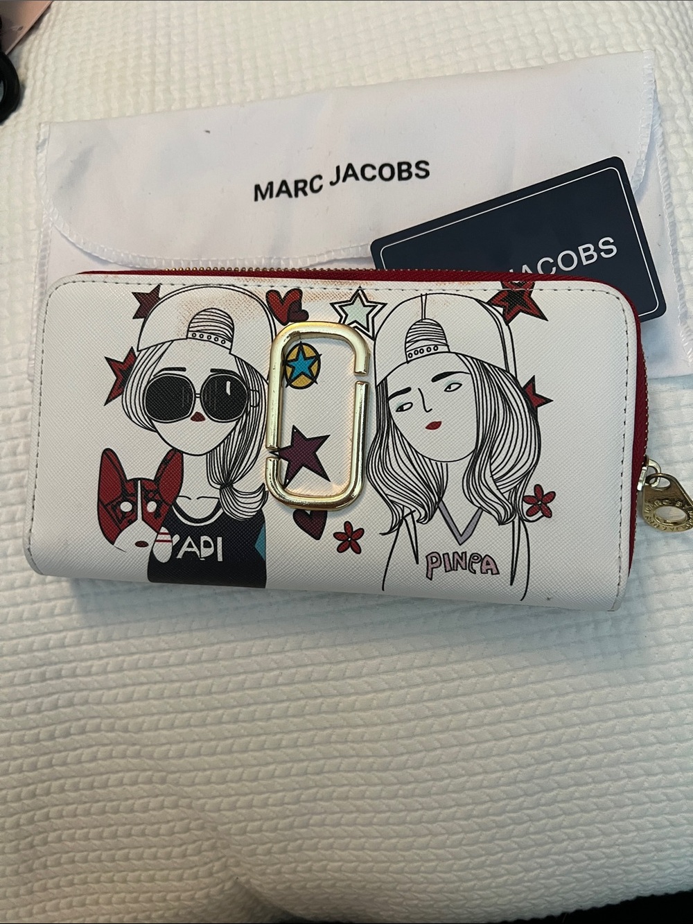 Marc Jacobs White Graphic Zip Wallet with Red Trim and Gold Hardware.